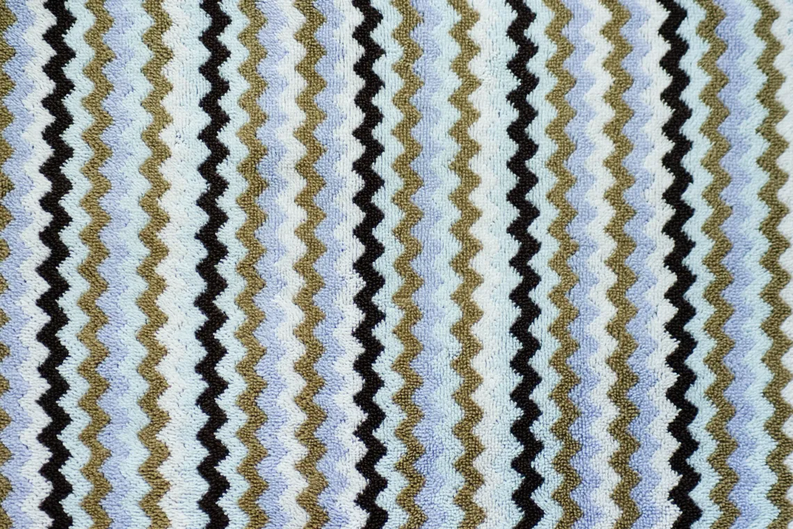 A towel fills the whole frame, of zigzags going up and down.